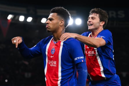 Désiré Doué with João Neves after scoring PSG’s first goal against Barcelona