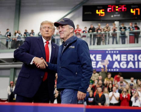 Republican senator Dan Sullivan shakes hands with Donald Trump in Wasilla, Alaska.