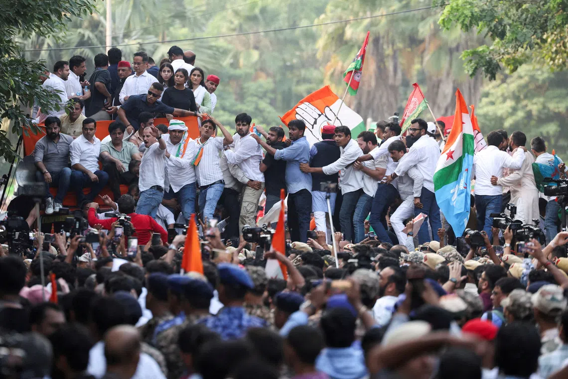 Supporters of opposition parties join in a march to protest a controversial revision of voter lists.
